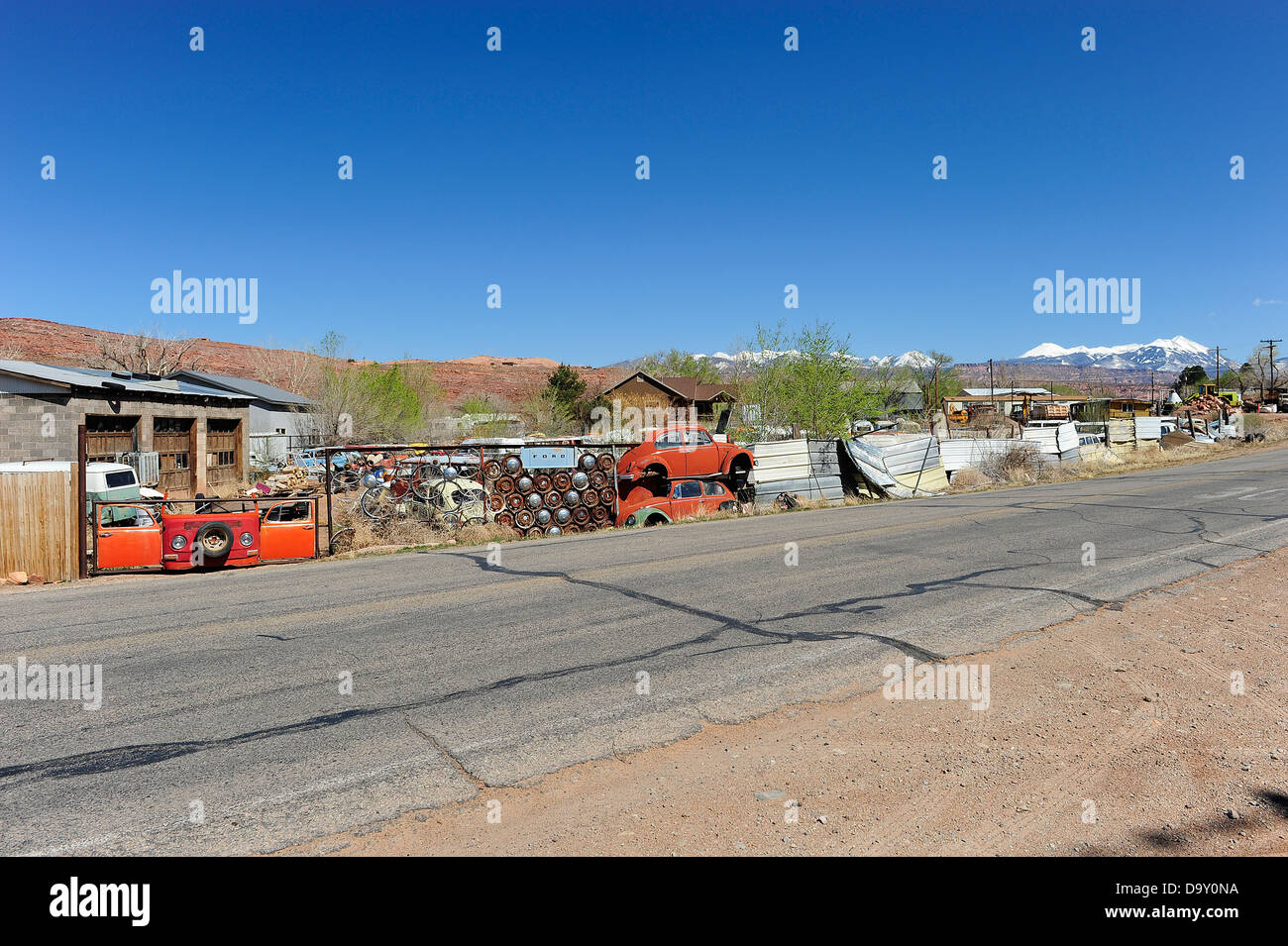 Scrap yard full of Volkswagen cars and vans. Near Moab, Utah, USA Stock