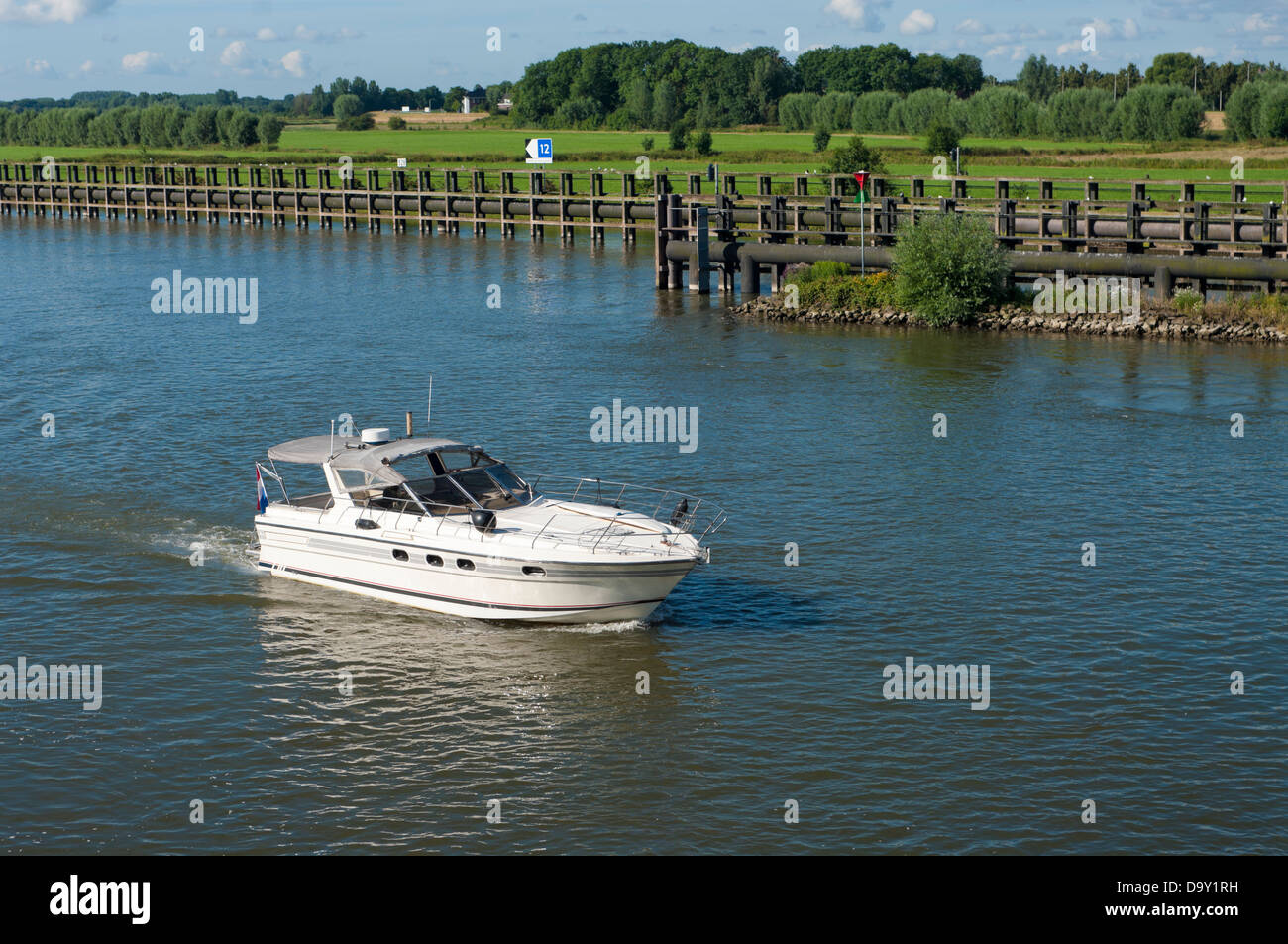 white motor yacht on a river Stock Photo - Alamy