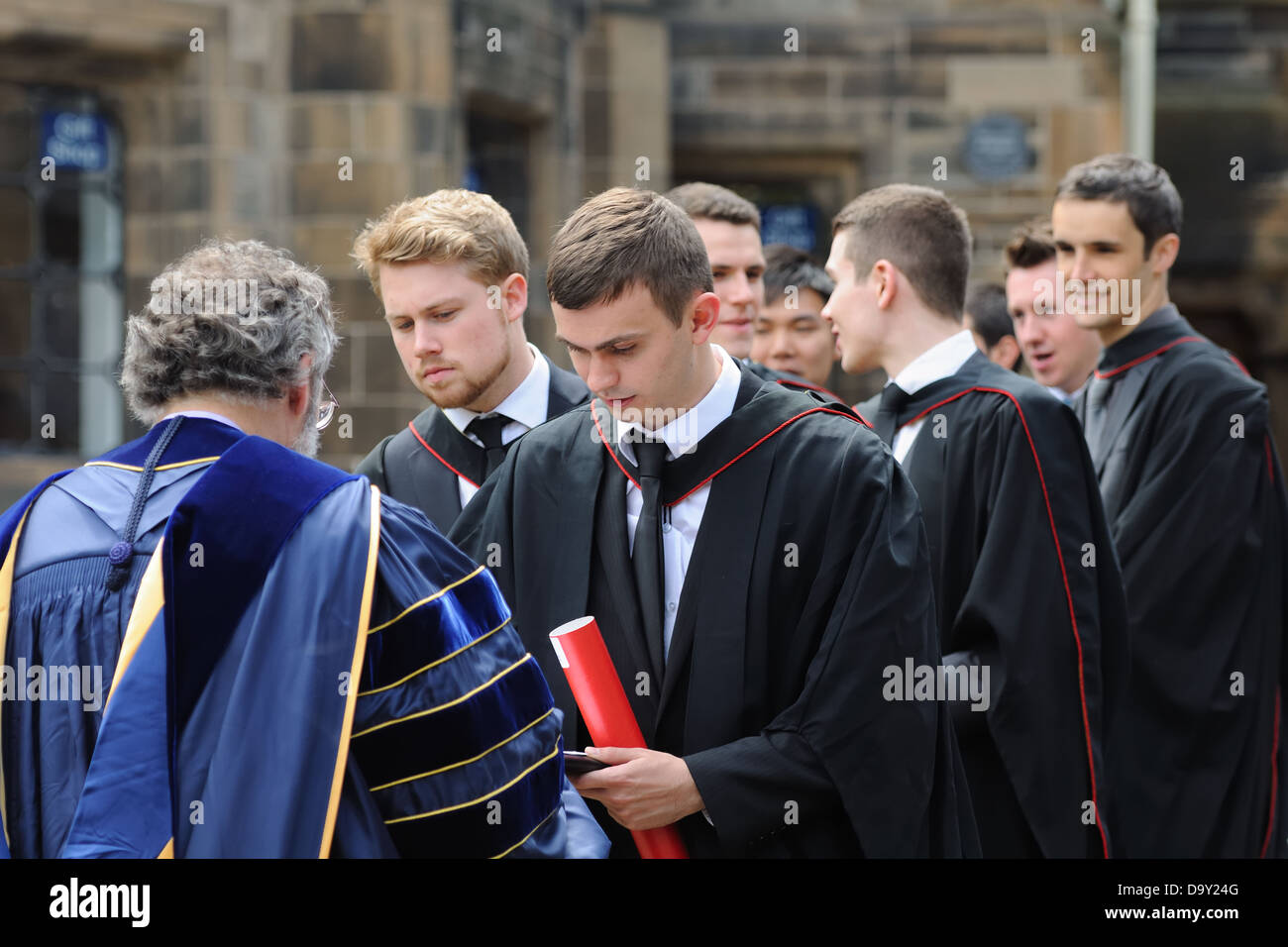 Graduates with their lecturer at Glasgow University, Scotland, UK Stock Photo