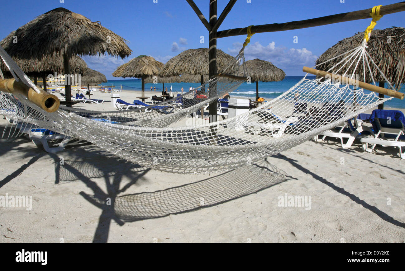 Hammocks, parasols and sun loungers on the beach of Varadero, Cuba, 23