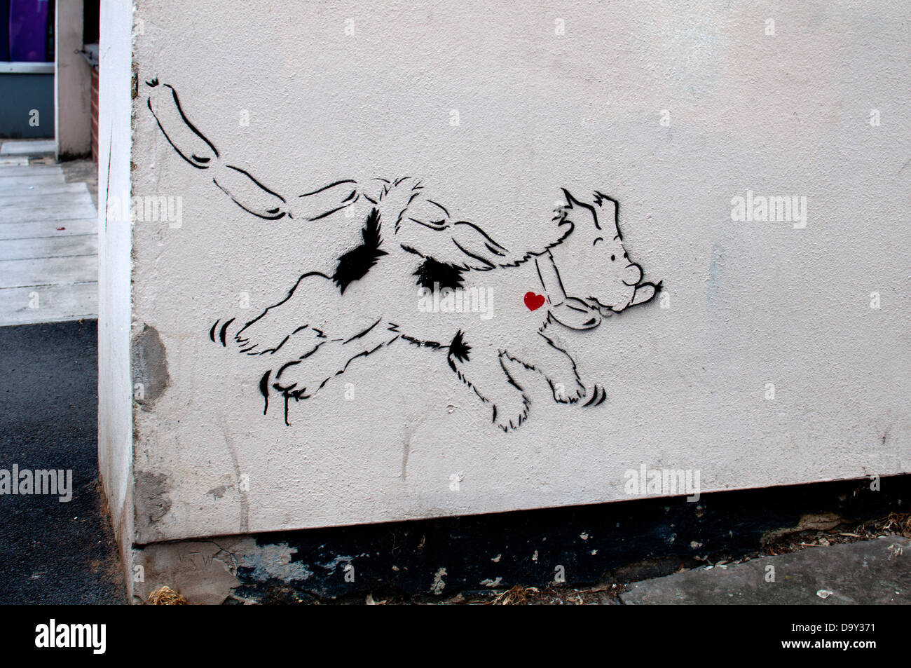 Dog with sausages Banksy, Cheltenham Spa, UK Stock Photo