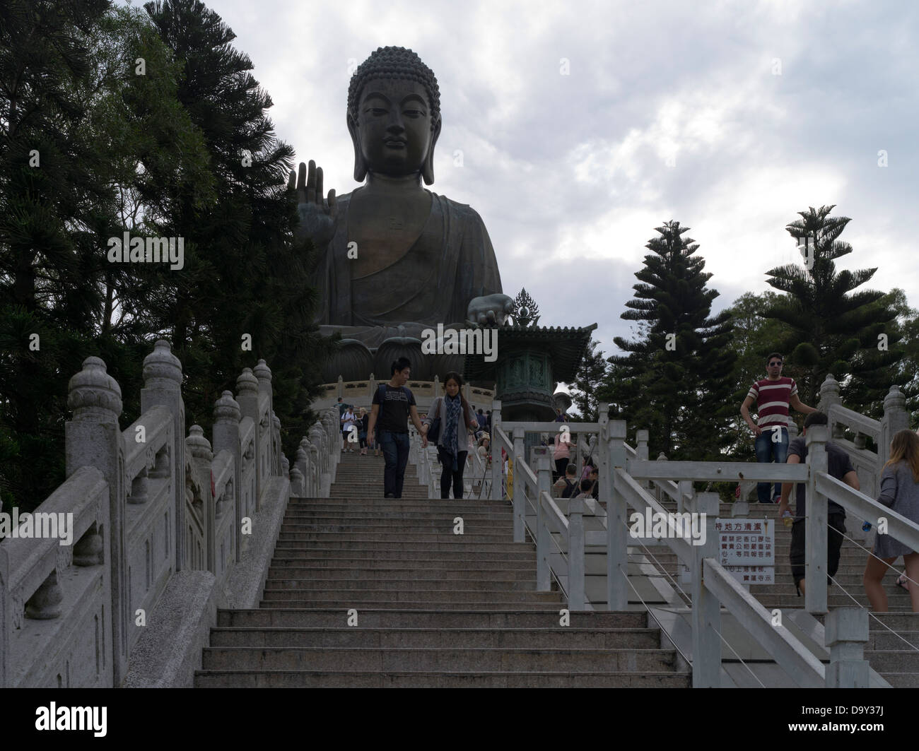 dh Tian Tan Buddha statue LANTAU HONG KONG Couple on steps tallest outdoor 34 metres high big chinese island Stock Photo