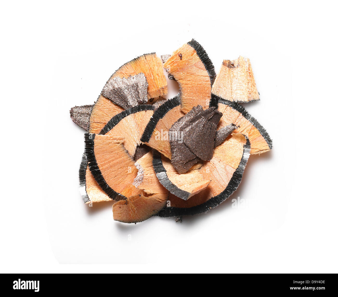 brown eyeliner pencil shavings cut out onto a white background Stock Photo