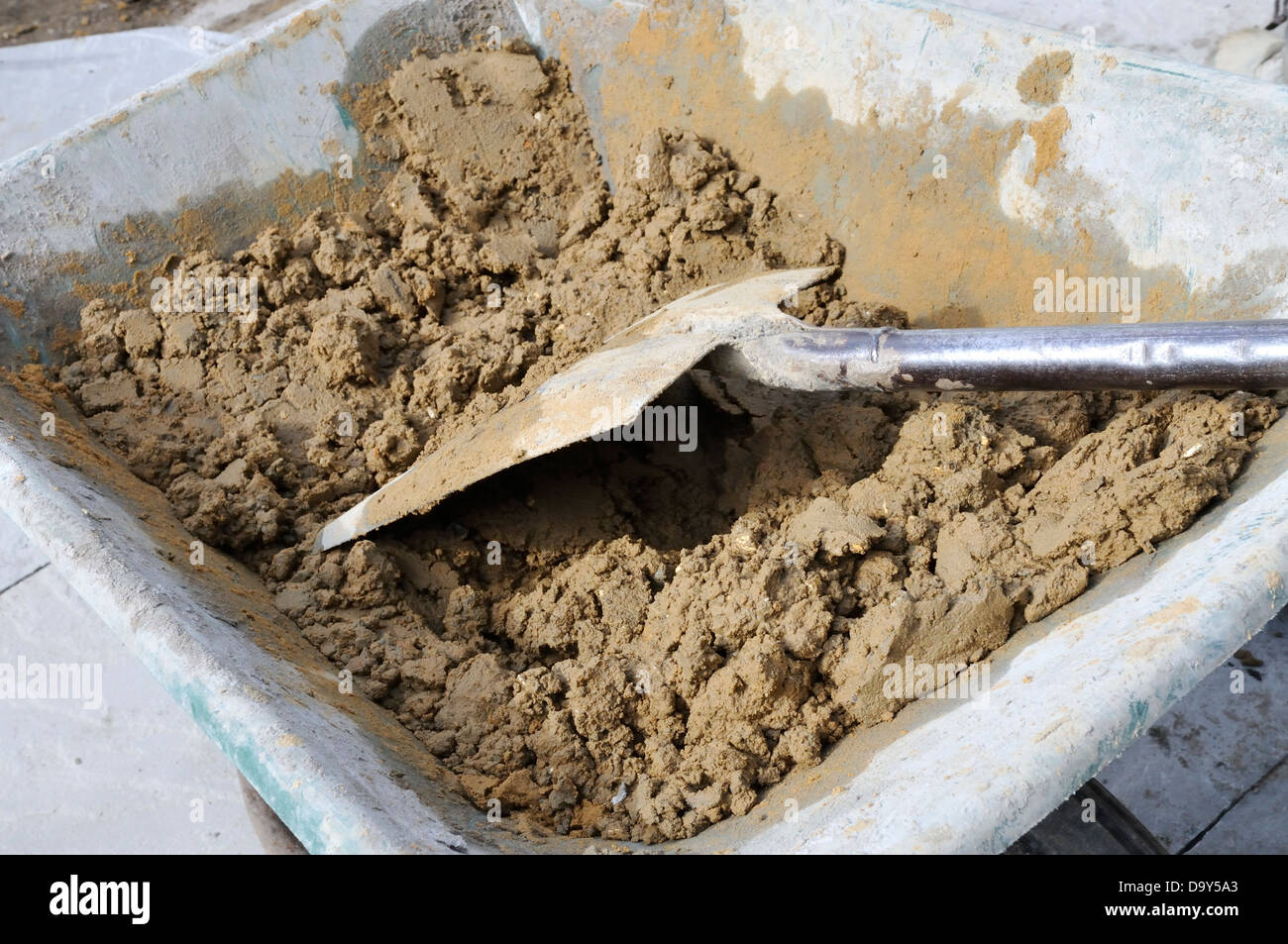 Mixing cement in wheelbarrow hires stock photography and images Alamy