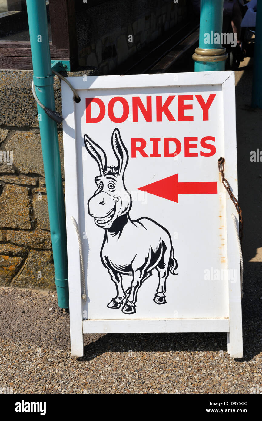 Sign 'Donkey Rides' on beach of Weston Super Mare UK Stock Photo