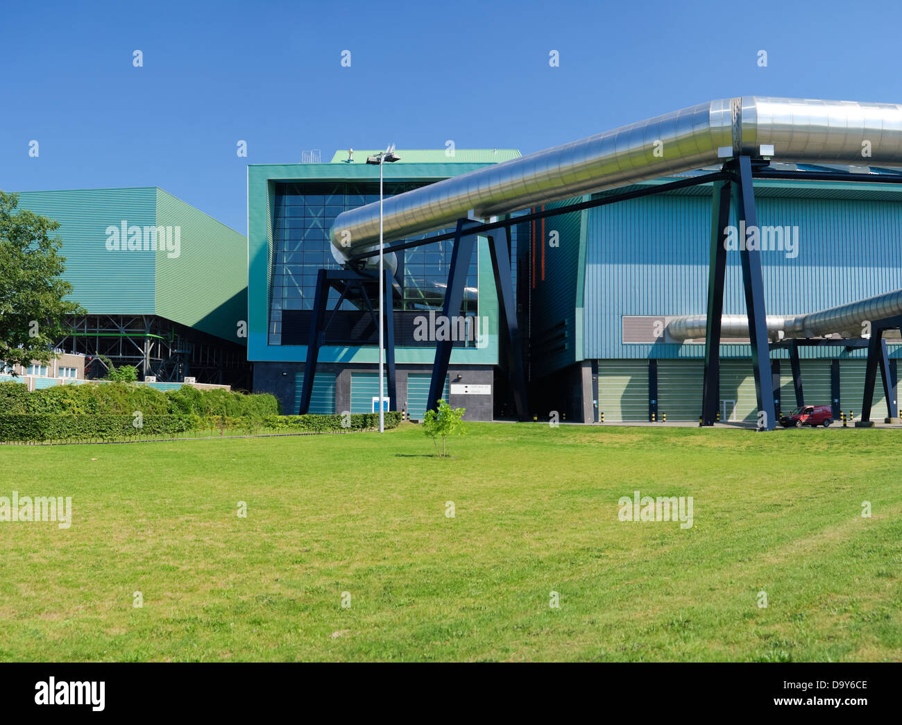 exterior of a modern waste treatment plant with giant pipes Stock Photo