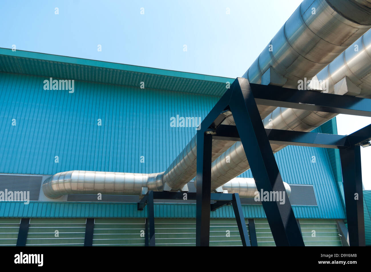 exterior of a modern waste treatment plant with giant pipes Stock Photo