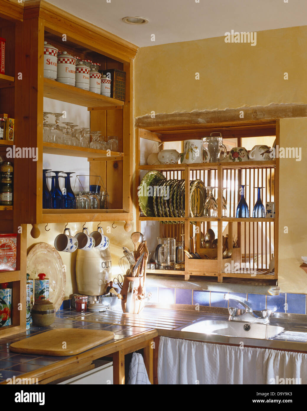 Storage Jars On Pine Shelving In Cottage Kitchen With Wooden Plate Stock Photo Alamy