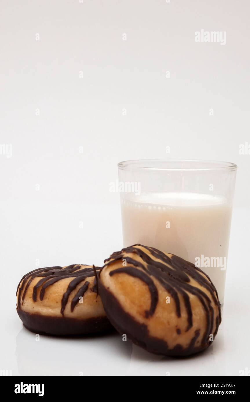 glass of milk with chocolate donut on a white background Stock Photo ...