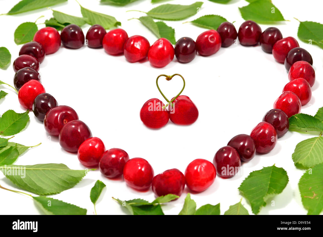 Cherry love on white background Stock Photo - Alamy