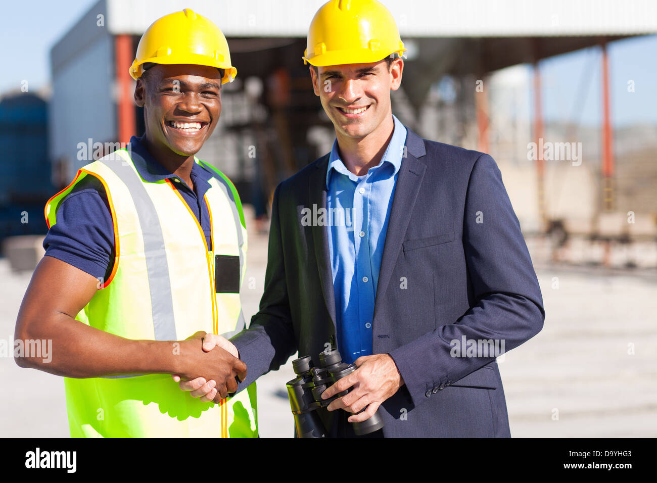 cheerful industrial manager and worker outdoors Stock Photo