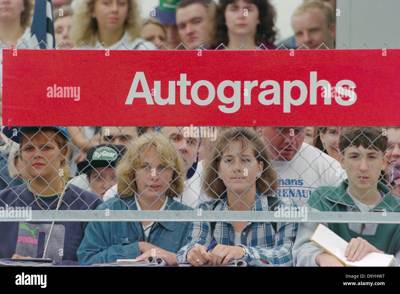 Fans wait for drivers autographs outside the paddock at Siverstone ...
