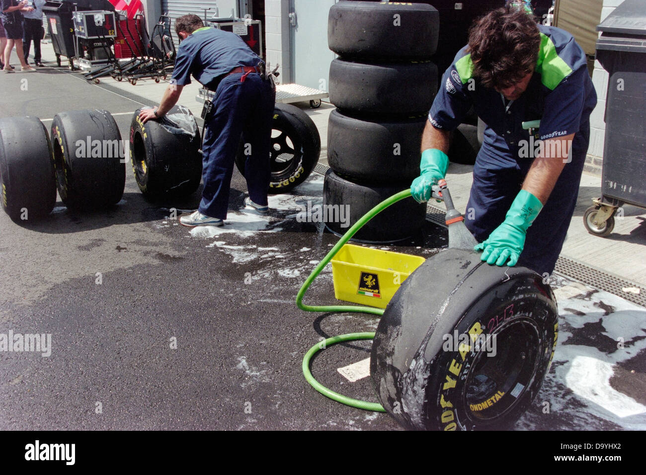 Goodyear tyre technicians clean wheels and tyres in preparation for the British Grand Prix at Silverstone in 1996 Stock Photo