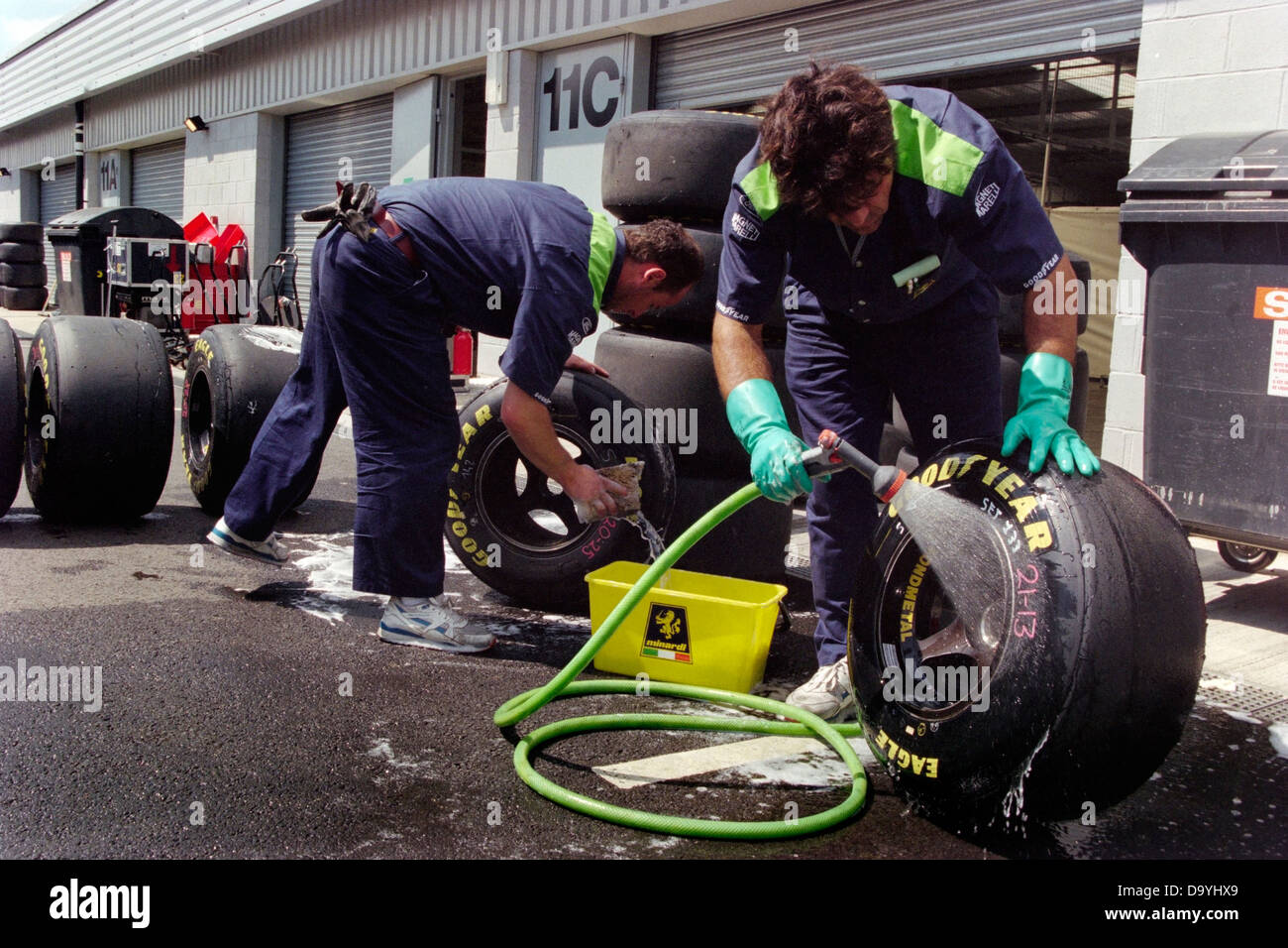 Goodyear tyre technicians clean wheels and tyres in preparation for the British Grand Prix at Silverstone in 1996 Stock Photo