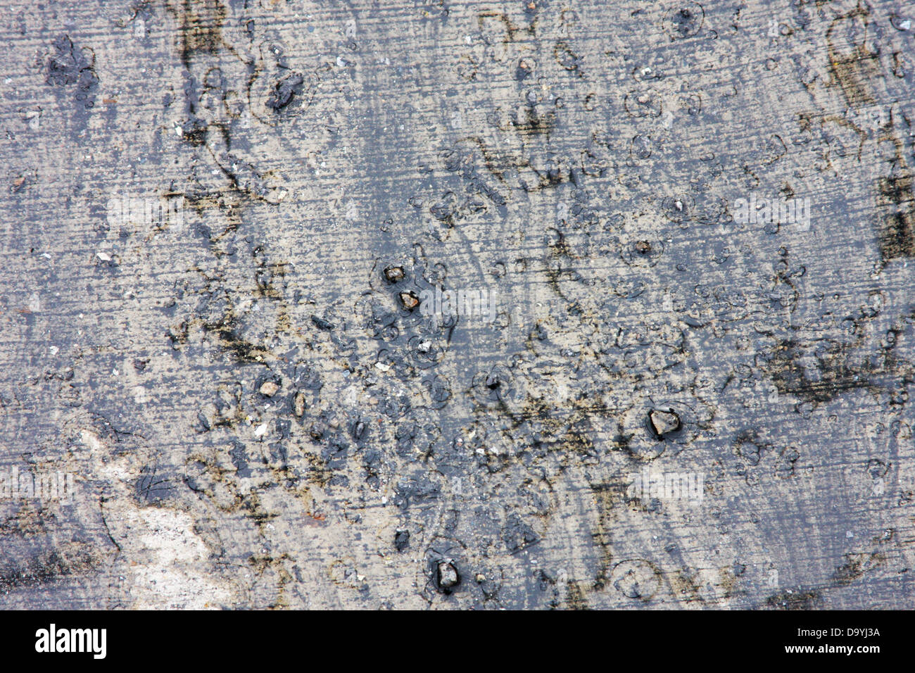 Pattern of water flowing around debris deposited from a fire building Stock Photo