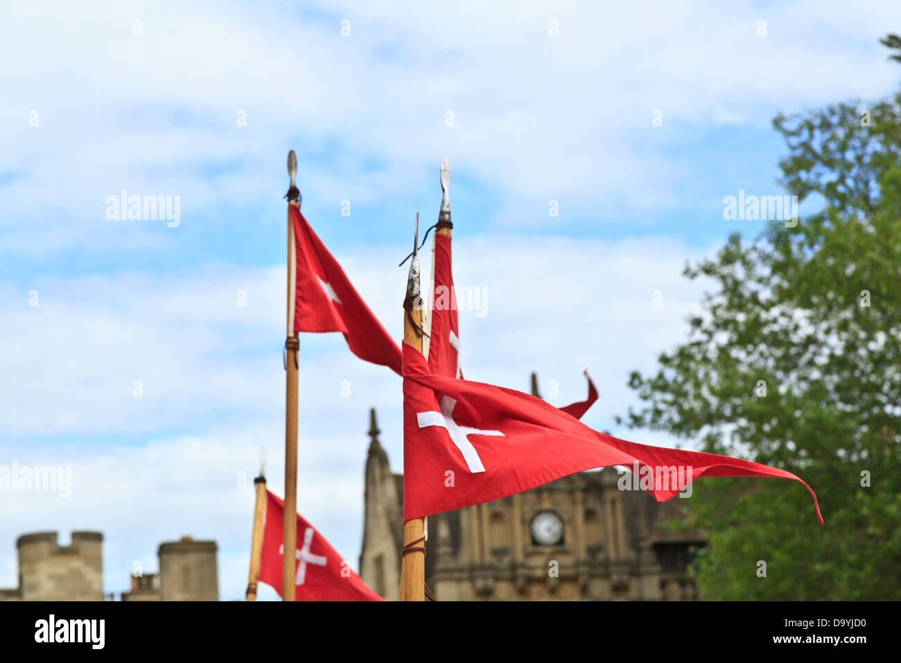 Red triangular flags with white cross on spear poles, Peterborough Heritage Festival 22 June 2013, England Stock Photo