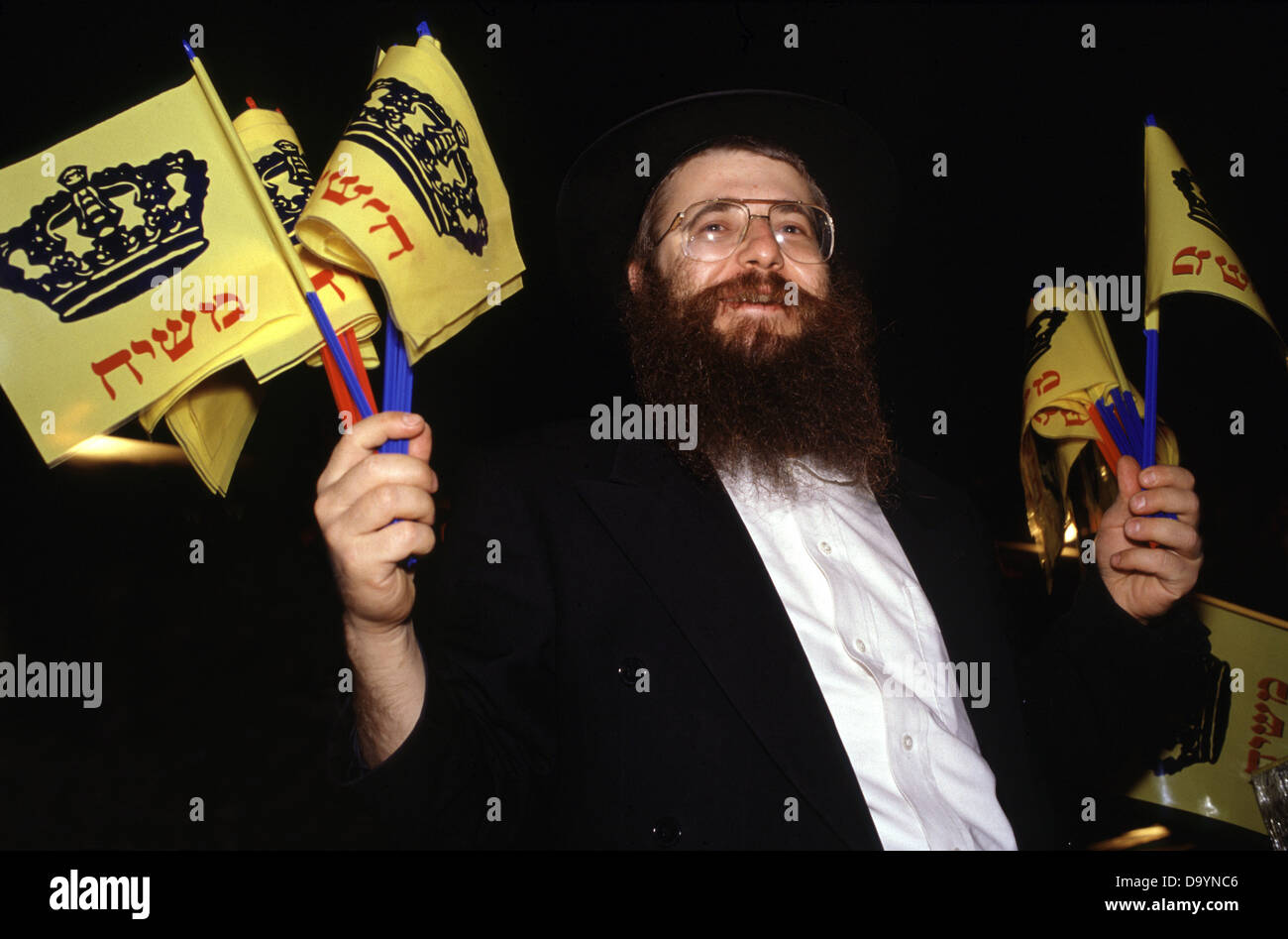 An Orthodox Jew from the Habad Lubavitch movement selling Flags that reads 'Messiah' in Israel Stock Photo
