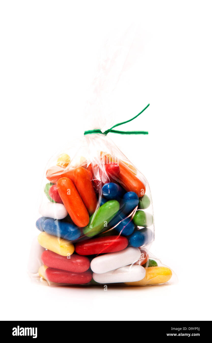 candy of many shapes and colors on white background Stock Photo - Alamy