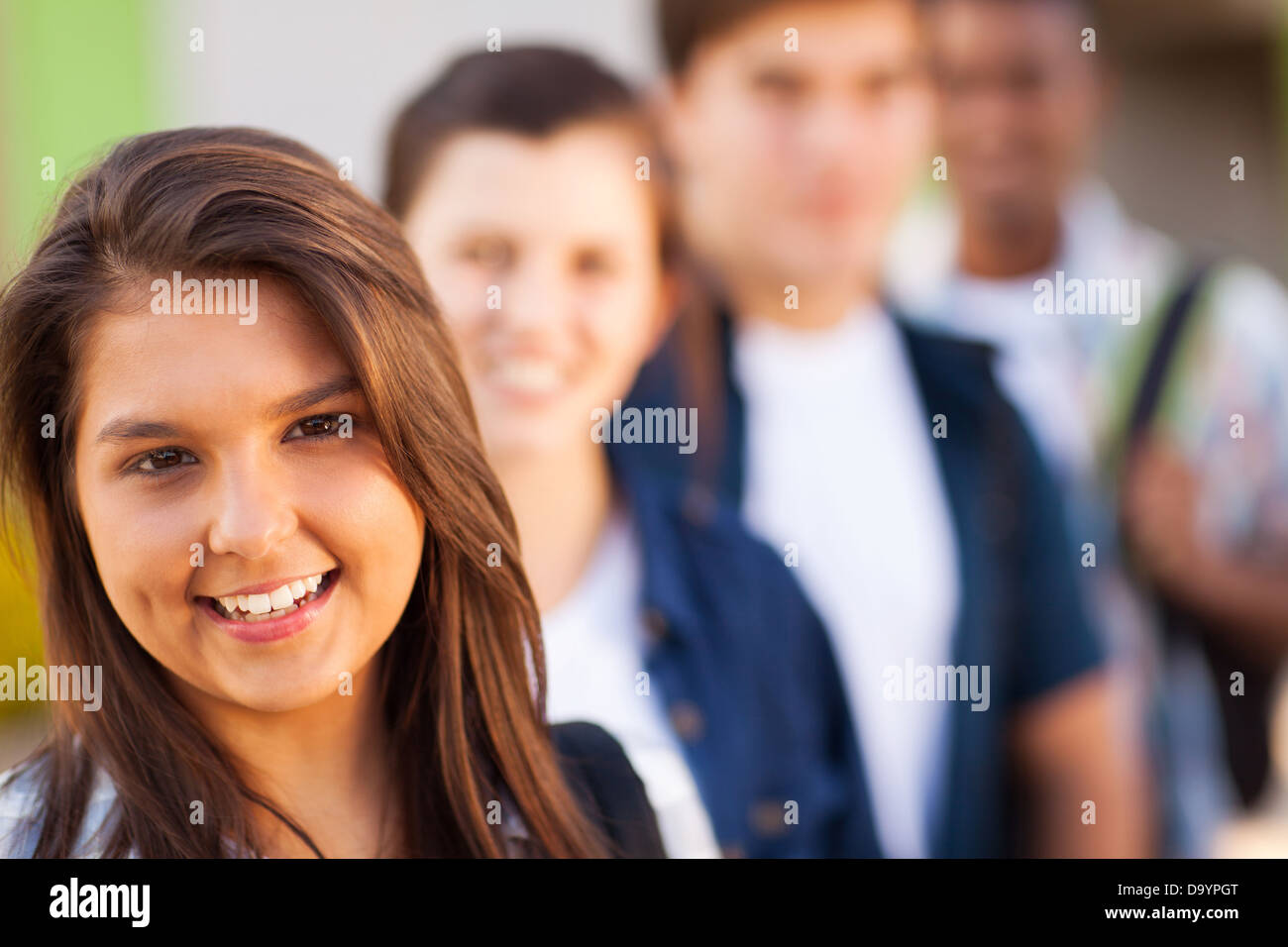 portrait of teenage high school girl with friends Stock Photo