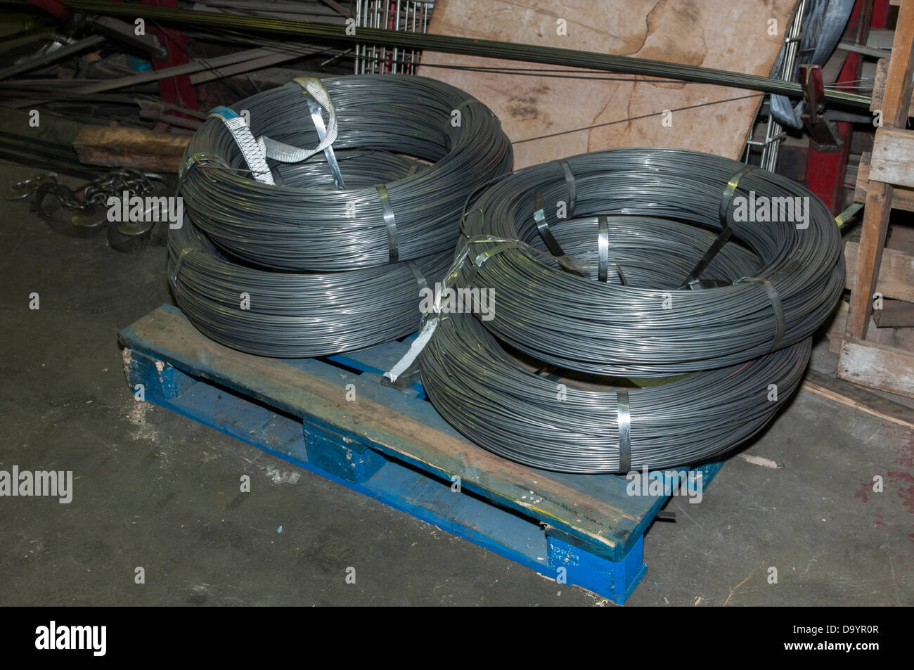 iron coil placed above the pallet ready to cut Stock Photo - Alamy