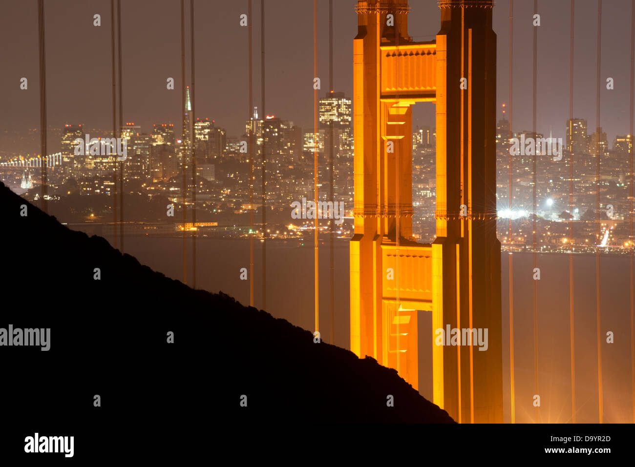 The Golden Gate Bridge frames the city of San Francisco at night, CA. Stock Photo