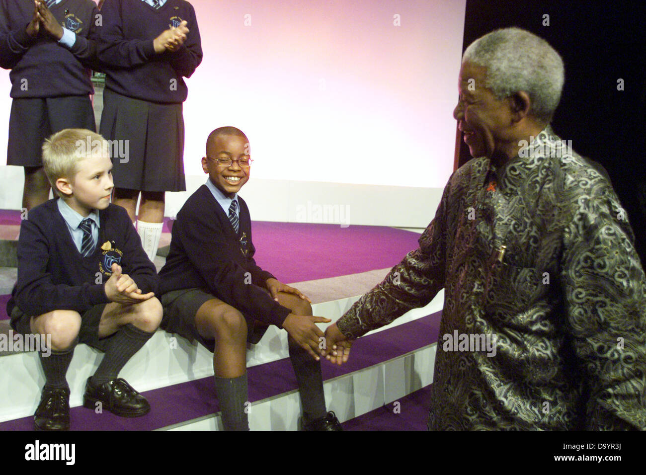 South African President Nelson Mandela meeting children from Brixton School Choir  and speaking at the Labour Party Conference in Brighton September 2000 Stock Photo