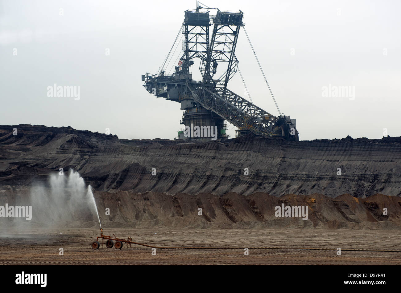 a bucket-wheel coal excavator working at a surface coal mine in Germany. Stock Photo