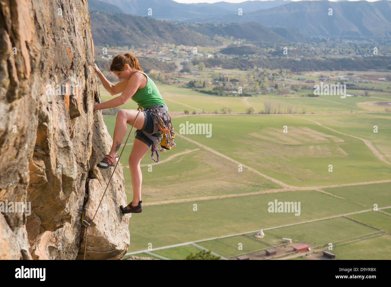 Woman rock climbing above fields in Durango, Colorado Stock Photo Alamy