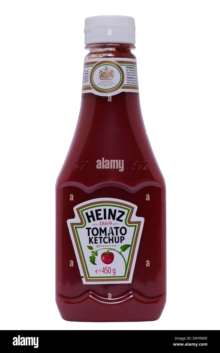 A sqeezy plastic bottle of Heinz Tomato Ketchup on a white background Stock Photo