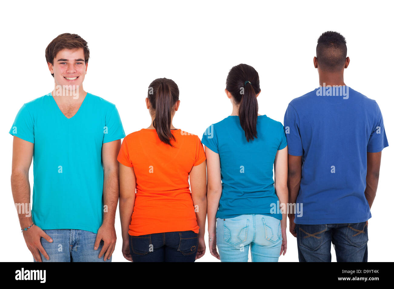 group of teens in a row with only one looking at camera Stock Photo