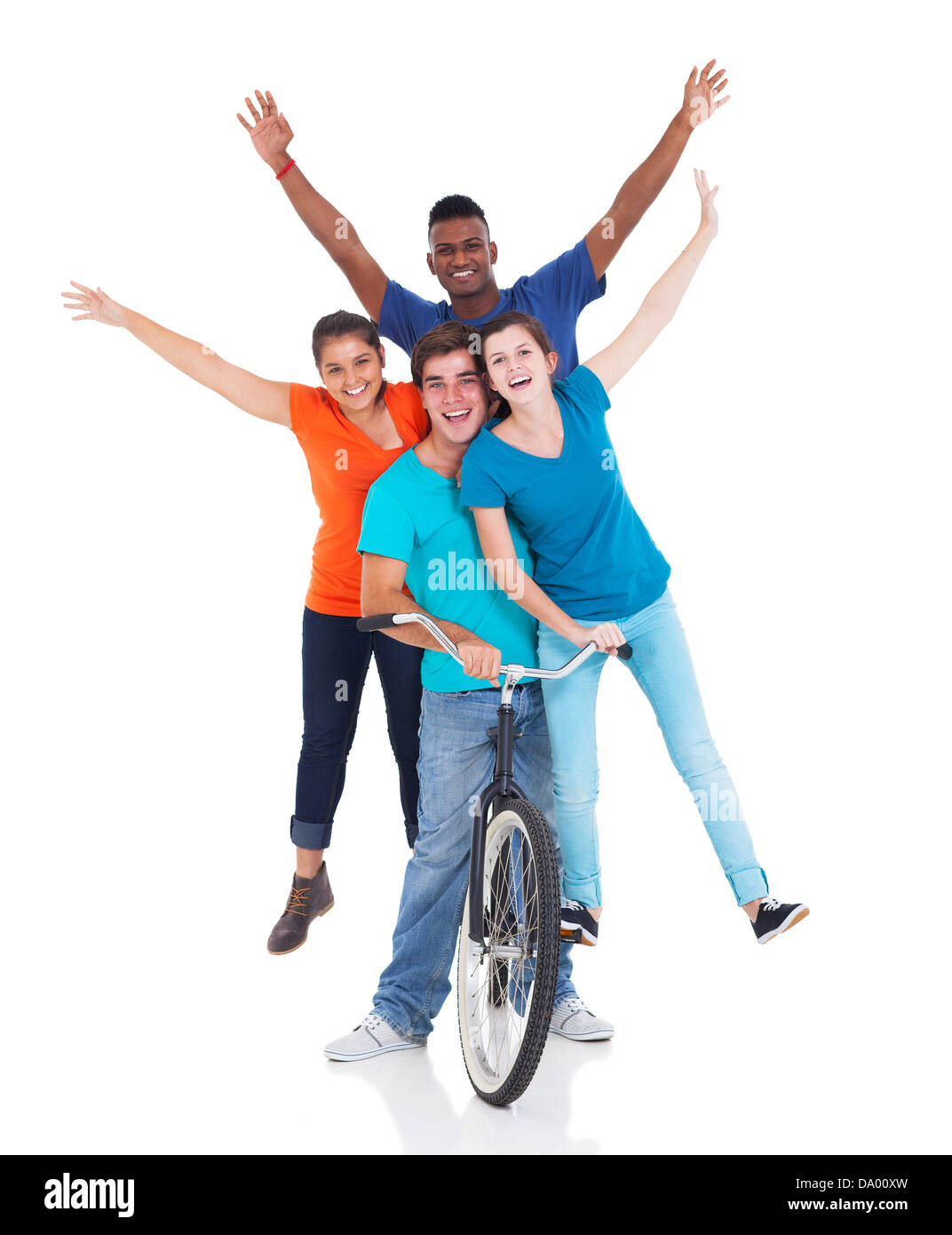 group of cheerful teenagers riding on bicycle isolated on white background Stock Photo