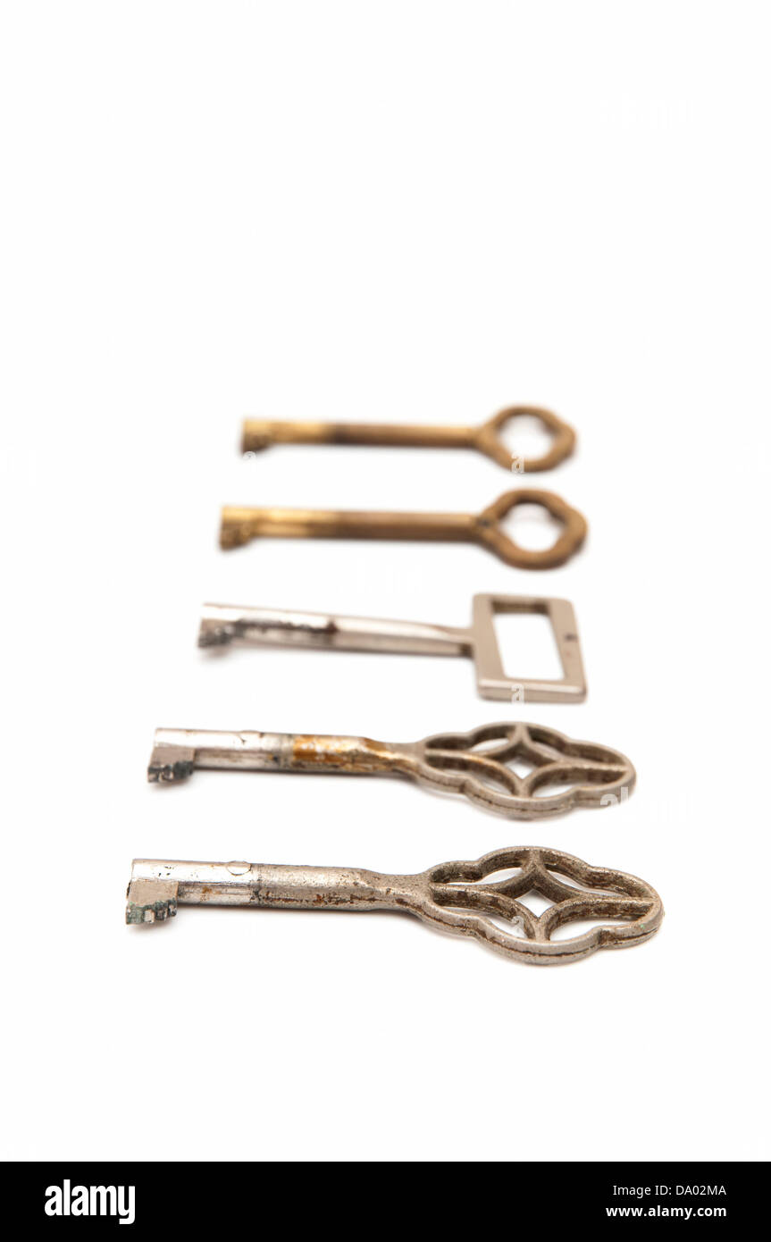 old keys on a white background Stock Photo Alamy