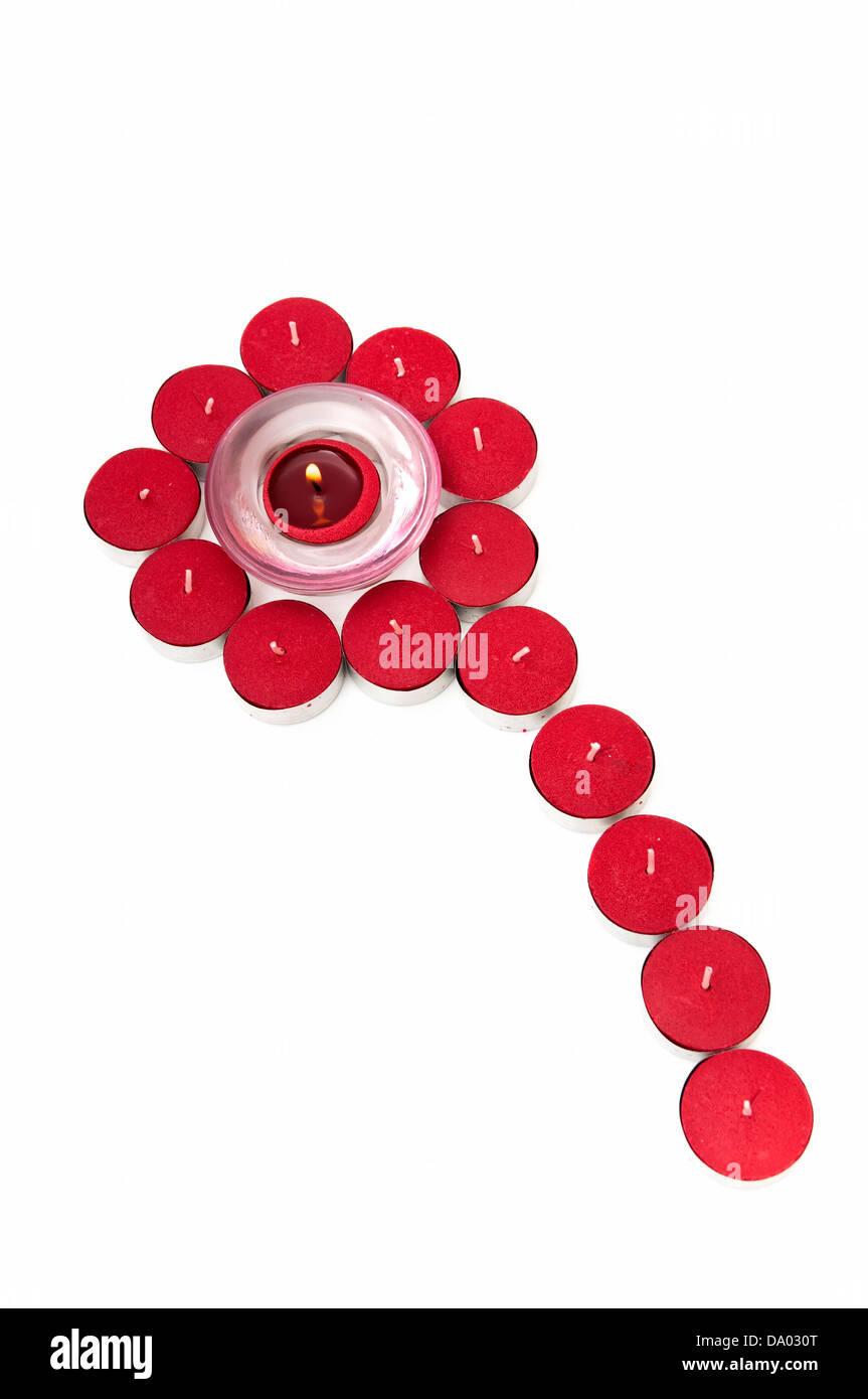 red candle making shapes on a white background Stock Photo Alamy