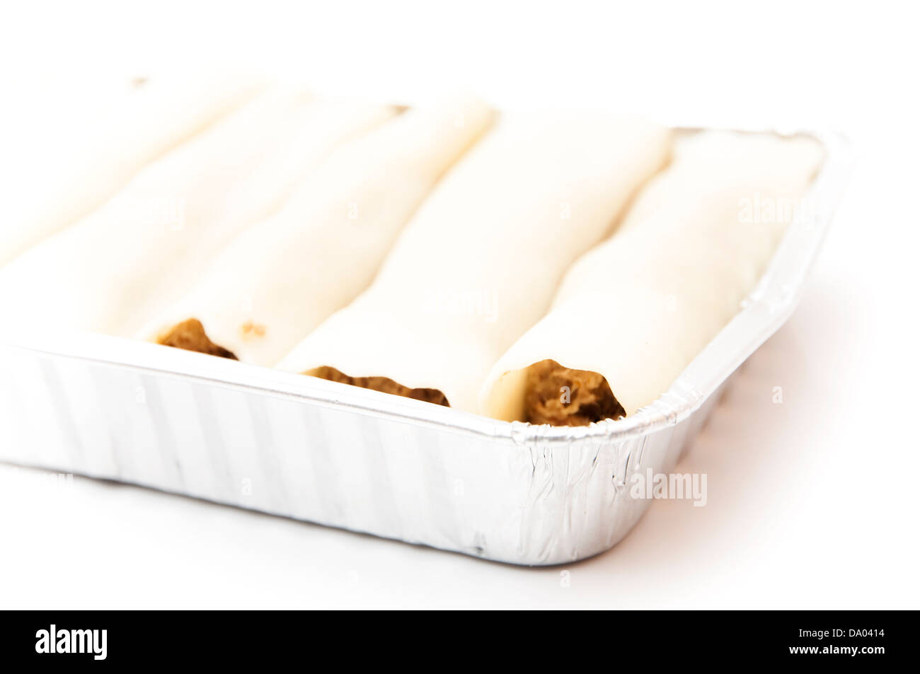 cannelloni in tray on a white background Stock Photo