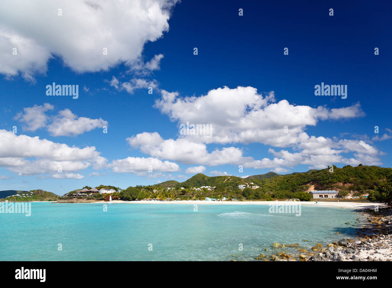 Perfect white caribbean beach with palm trees and turquoise sea. Cocobay Beach, Antigua. Stock Photo