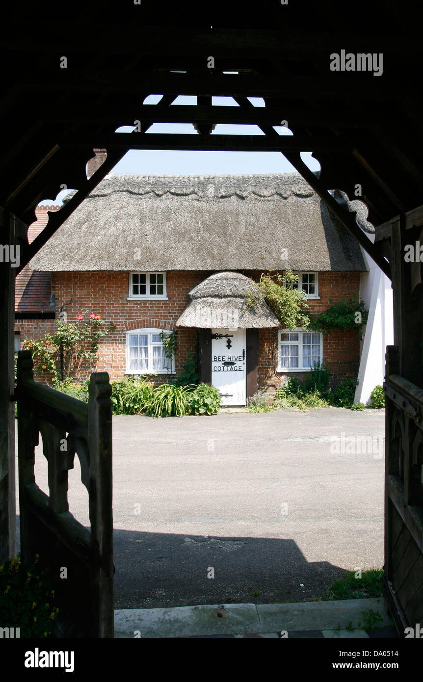 thatched cottage from Lych Gate Puddletown Thomas Hardy's Weatherbury Dorset England UK Stock Photo