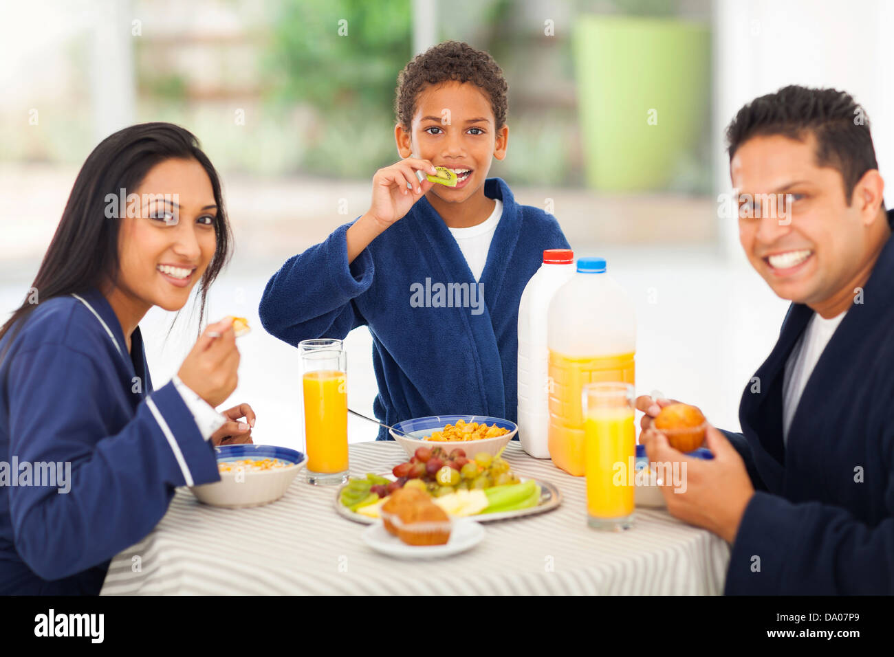 cheerful cute indian family enjoying their breakfast together Stock Photo