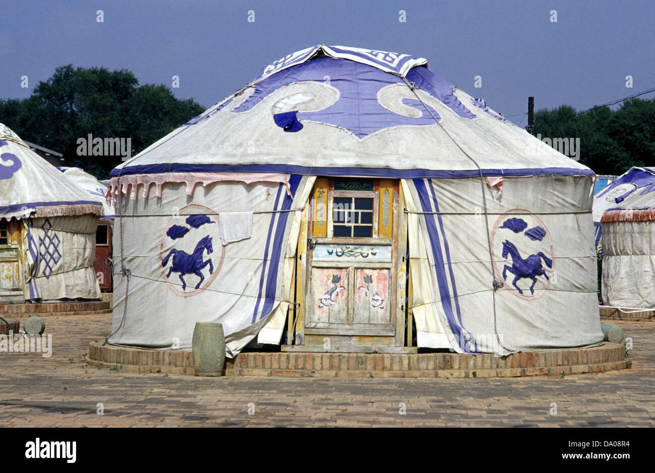 A traditional Mongolian yurt or ger which portable, round tent covered with felt and used as a dwelling by nomads in the steppes of Central Asia. Stock Photo