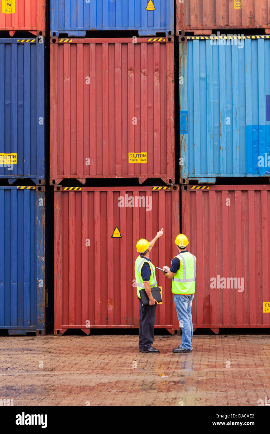 shipping company workers counting containers at depot Stock Photo Alamy
