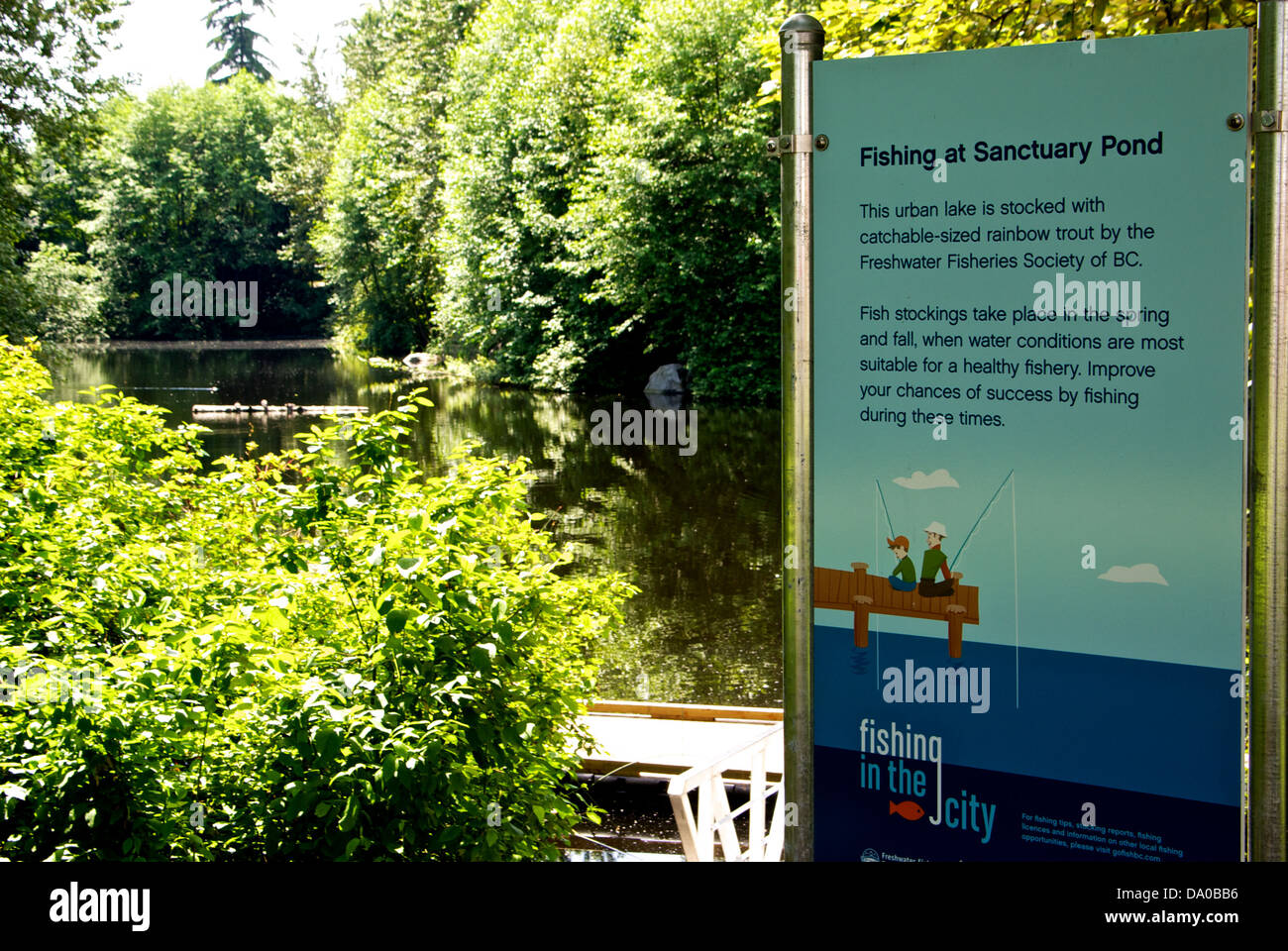 Freshwater Fisheries Society BC Fishing in City sign Sanctuary Pond Hastings Park Vancouver Stock Photo