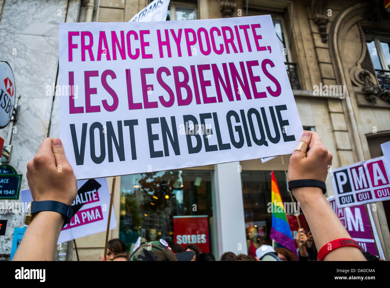 Paris, France, LGBT Groups Protesting in Annual Gay Pride March,  French Sign: 'France Hypocrite, Lesbians g-o to Belgium' (For Right to Artificial Insemination) ( Collective 'Oui, Oui, Oui') gay rights struggle Stock Photo