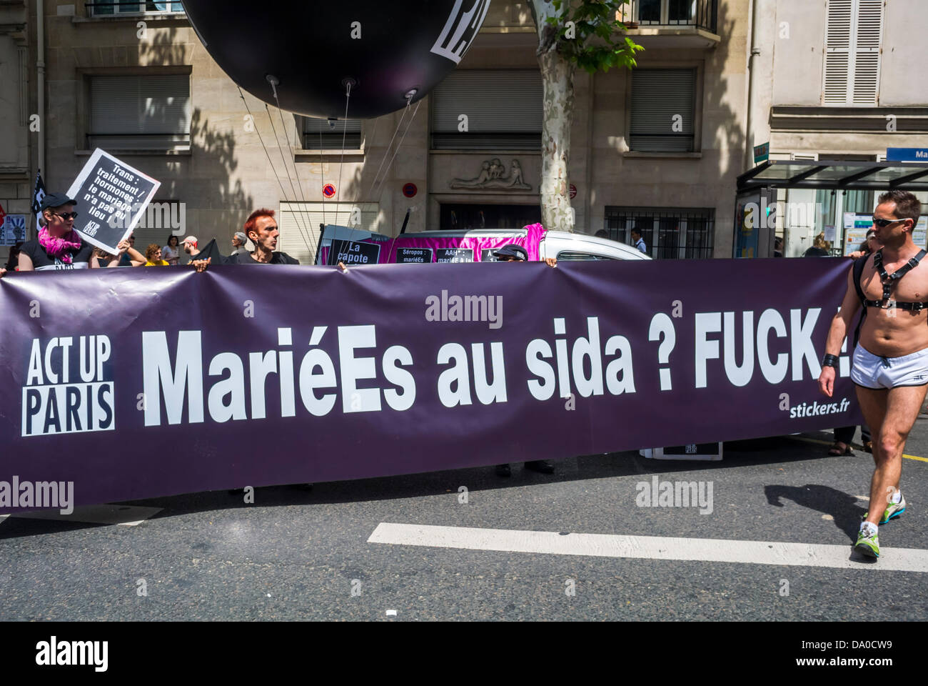 Paris, France, lgbt parade banner Group People, Act Up Paris, Marching in Annual Gay Pride Parade, with Banner that reads: 'Married to AIDS, F*ck' Stock Photo