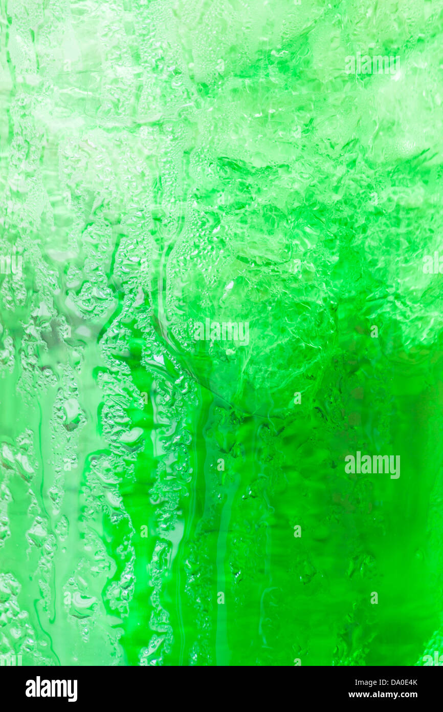 Sweet green water with ice cubes background Stock Photo - Alamy