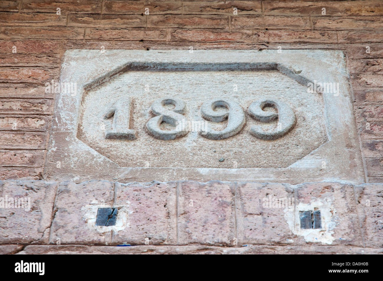 1899 number written on the stone wall Stock Photo - Alamy