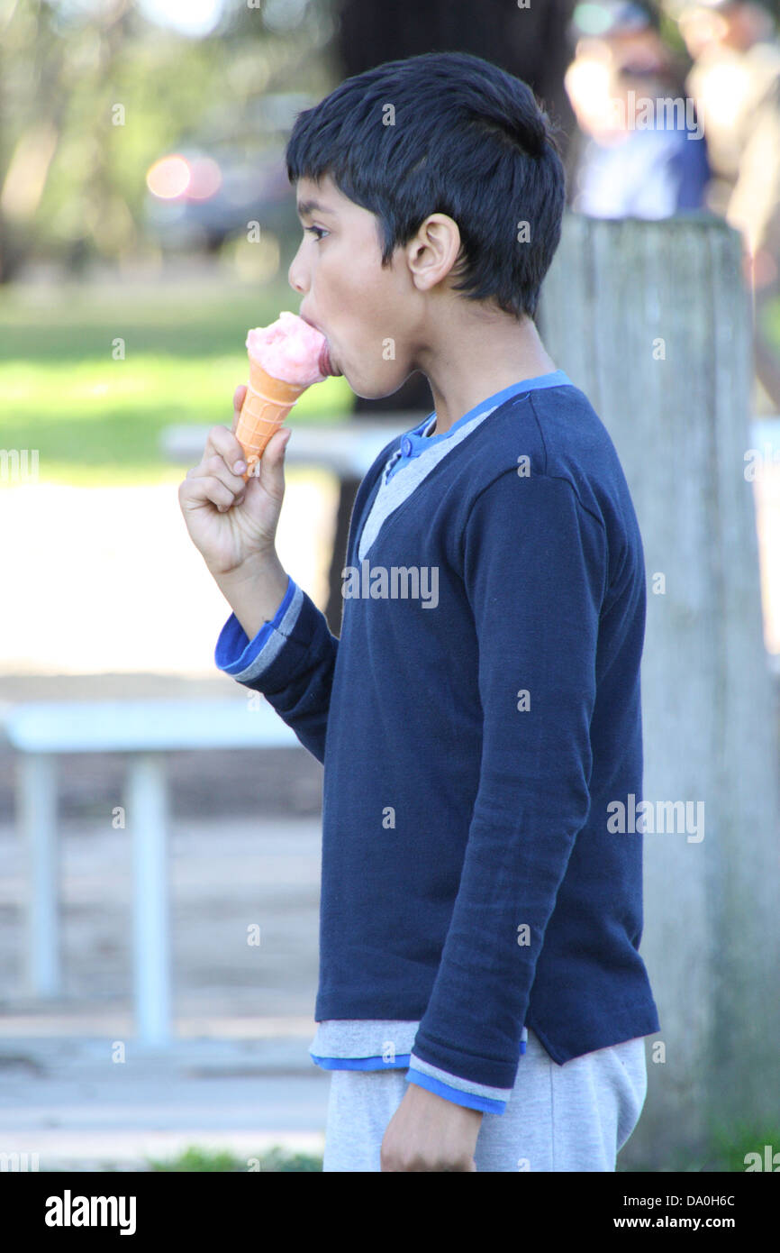 Boy eating ice cream Stock Photo - Alamy