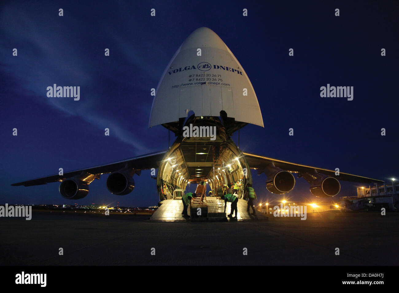 The crew of a Russian Antonov An-124 cargo aircraft prepares to load three CH-46E Sea Knight helicopters June 17, 2013 at Marine Corps Air Station Futenma, Japan. Stock Photo