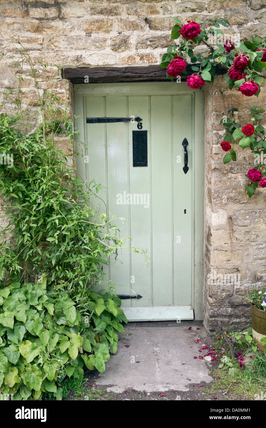 The pretty front door of one of the cottages that comprise Arlington Row in Bibury, Gloucestershire, UK Stock Photo