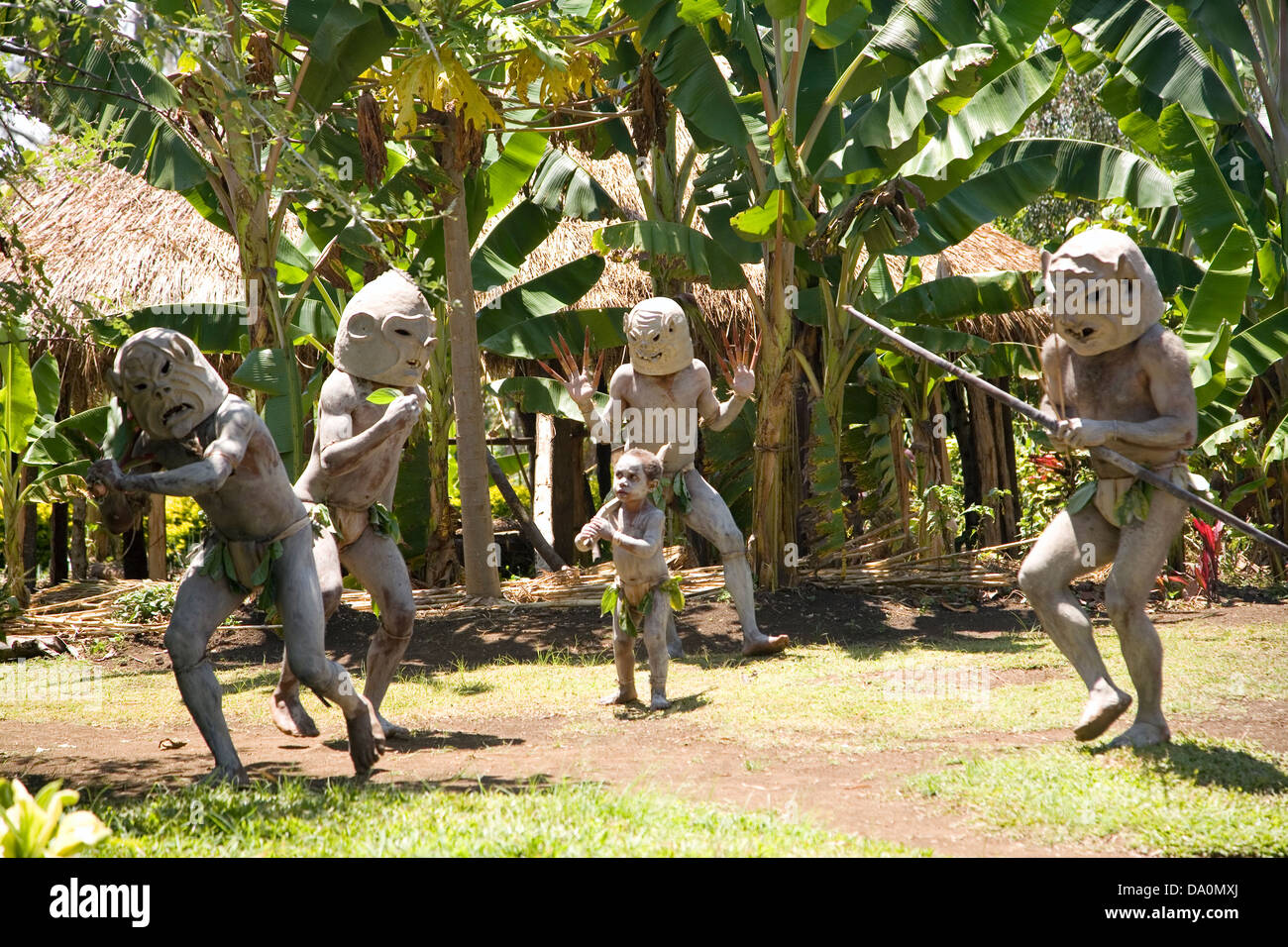 Mud men battle scene recreation by Asaro villagers, Asaro District of the Eastern Highlands, Papua New Guinea. Stock Photo