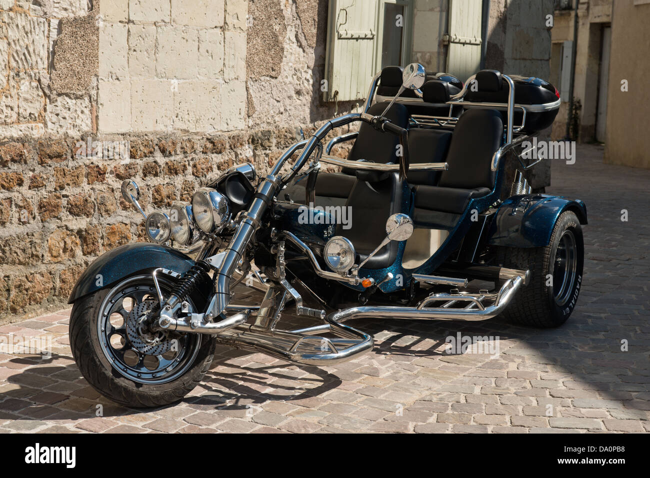 A British Boom trike in a French Village street Stock Photo