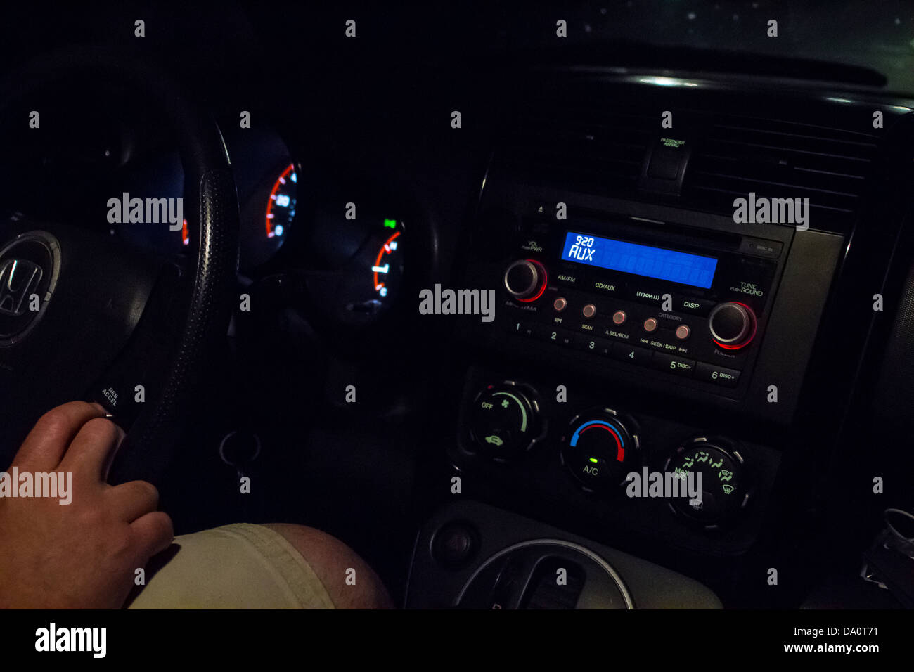The Dashboard of a Honda Element while traveling at night Stock Photo